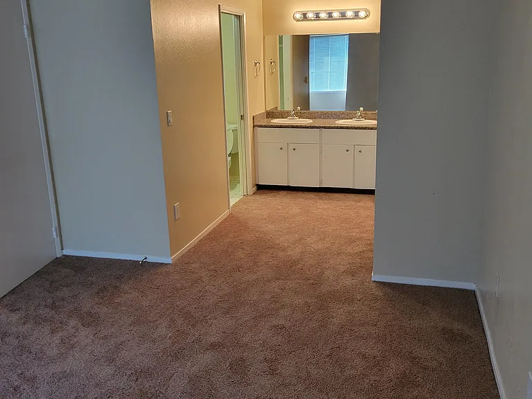 master bedroom towards vanity and bathroom