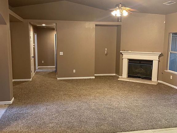 Master living room with fireplace.