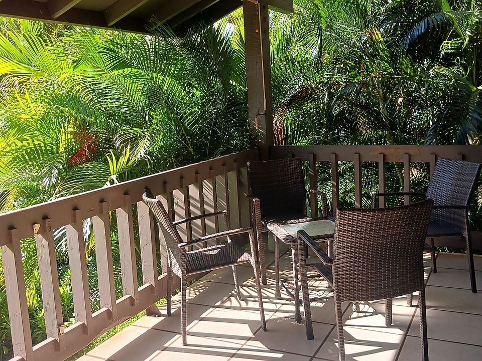large lanai with private corner surrounded by Hawaiian plants