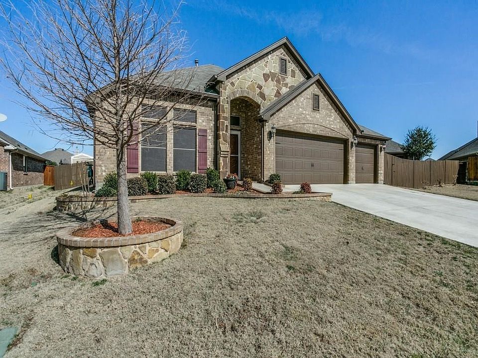 816 Big Willow Drive! Beautiful stone accents, shutters, Carriage garage doors!