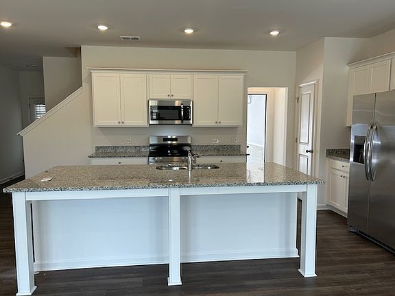 Spacious kitchen and a large granite top