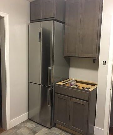 Slimline tall bottom freezer fridge.