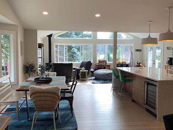 Upstairs dining area, kitchen island seating and family room with view to Lake Ki.