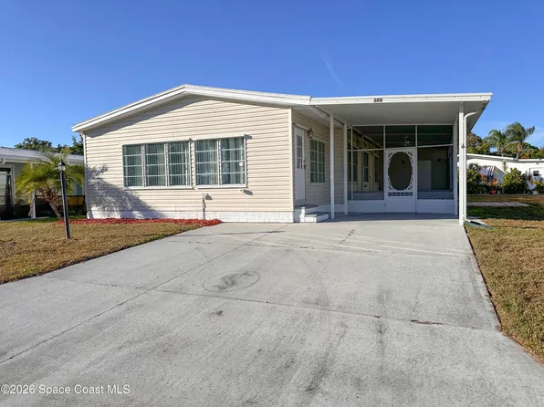 606 Dolphin Cir, Barefoot Bay, FL 32976