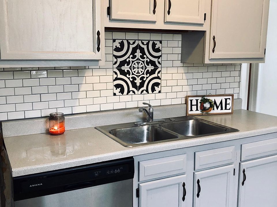 Freshly painted kitchen in neutral and modern tones.