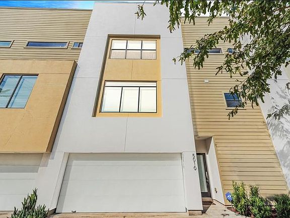 Two-car garage w/ additional storage space and cabinets