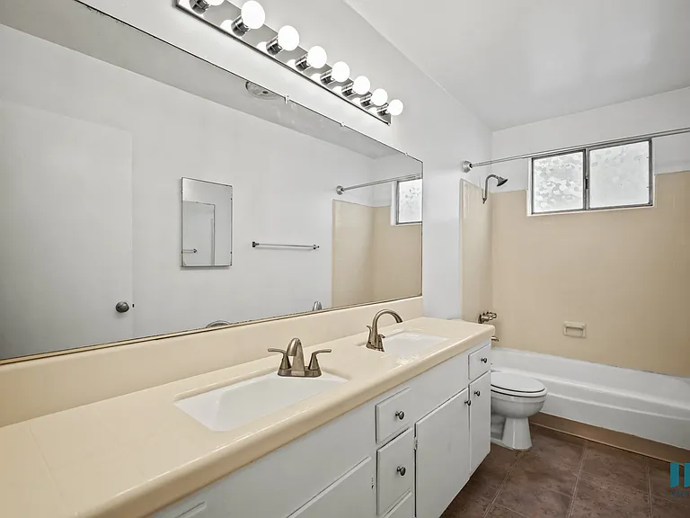 Bathroom with a Shower-Bath and Vanity Cabinet Storage