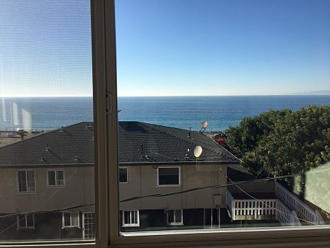 partial ocean view from lower level bedroom