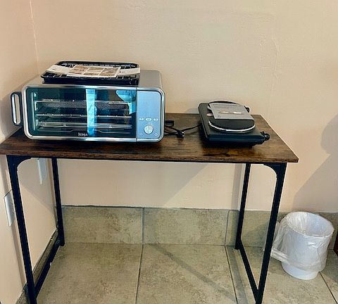 Small cooking station with oven & air fryer, and two burner stove top.