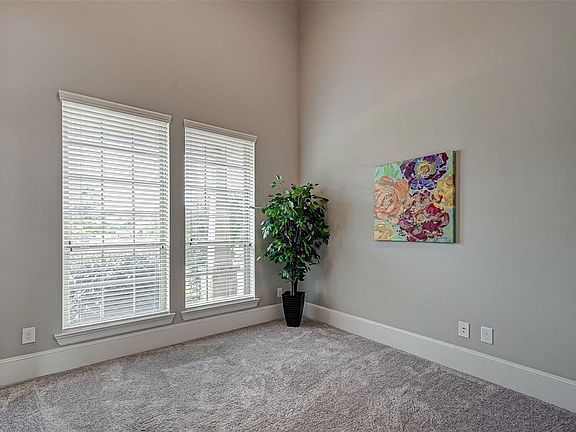 Another view of your study with large baseboards and nice plush carpet.
