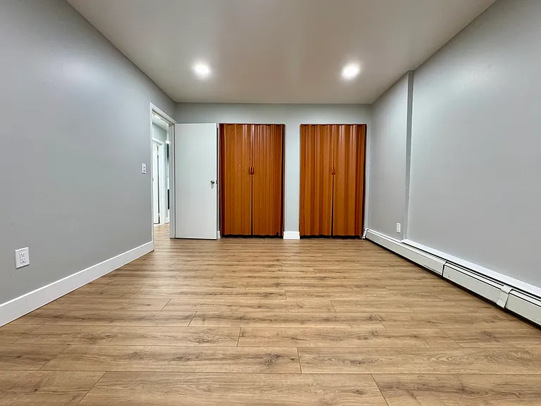 The 1st Bedroom includes brand new flooring and new ceiling lights.