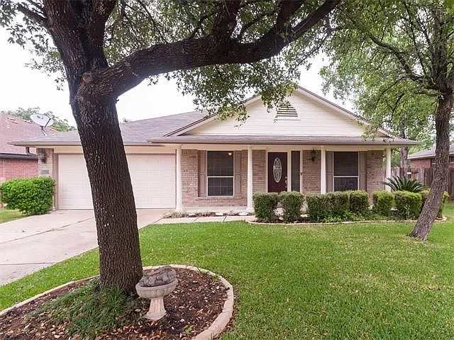 Excellent brick home surrounded by mature trees.