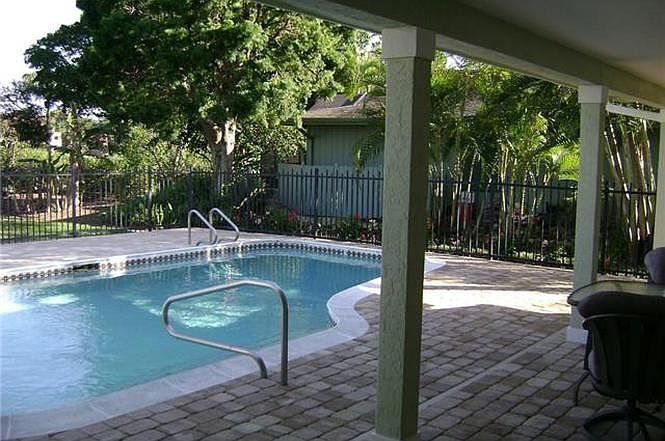Pool overlooking golf course.