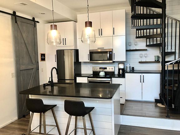 Kitchen with granite counter tops and tons of light!