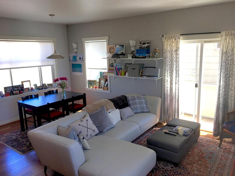 Open floor plan living with lots of windows