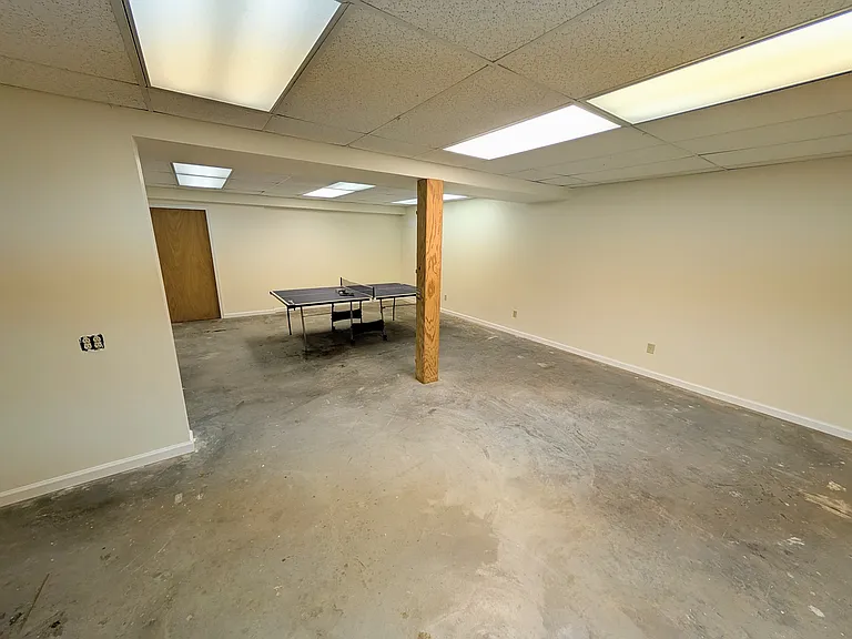 The basement is massive. It just got a fresh refinish. Perfect for a workshop, sports room, or whatever your hobby.