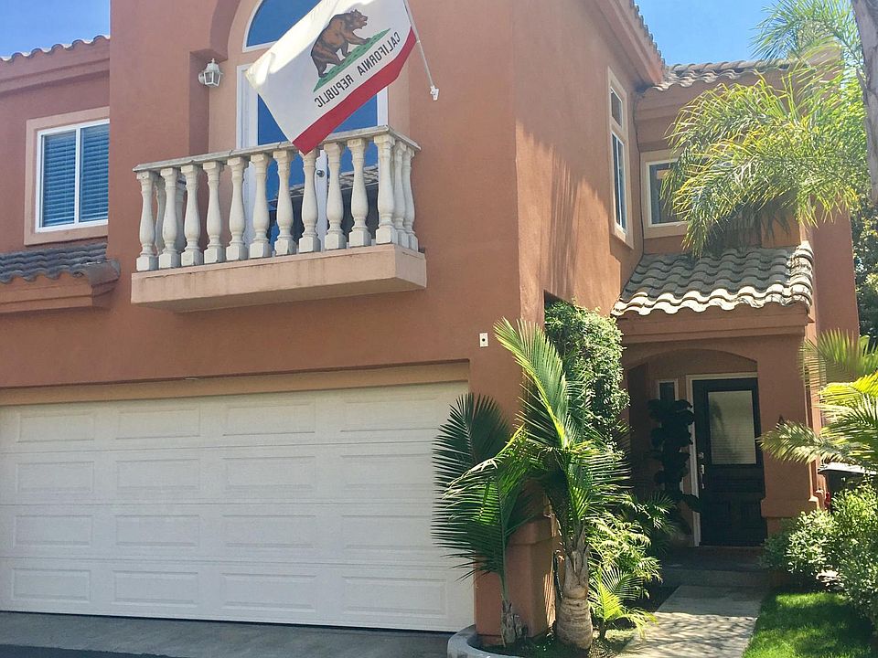 Two car garage with balcony off master bedroom