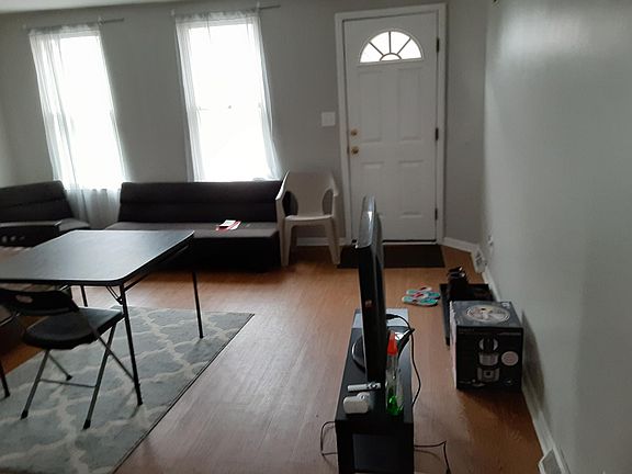 Living room and front door to Carey Way
