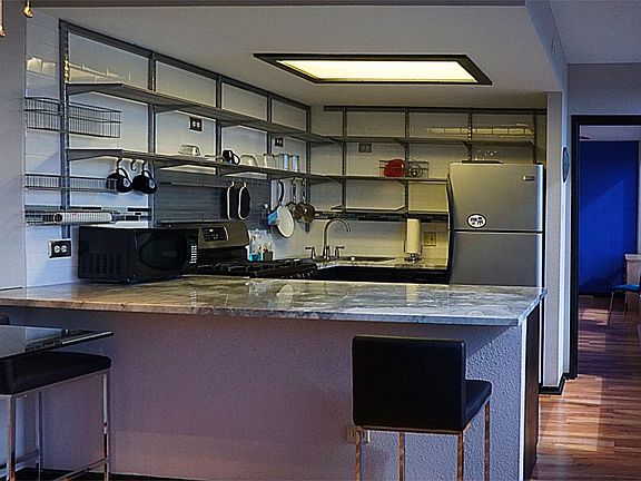 lots of light and storage with marble kitchen island