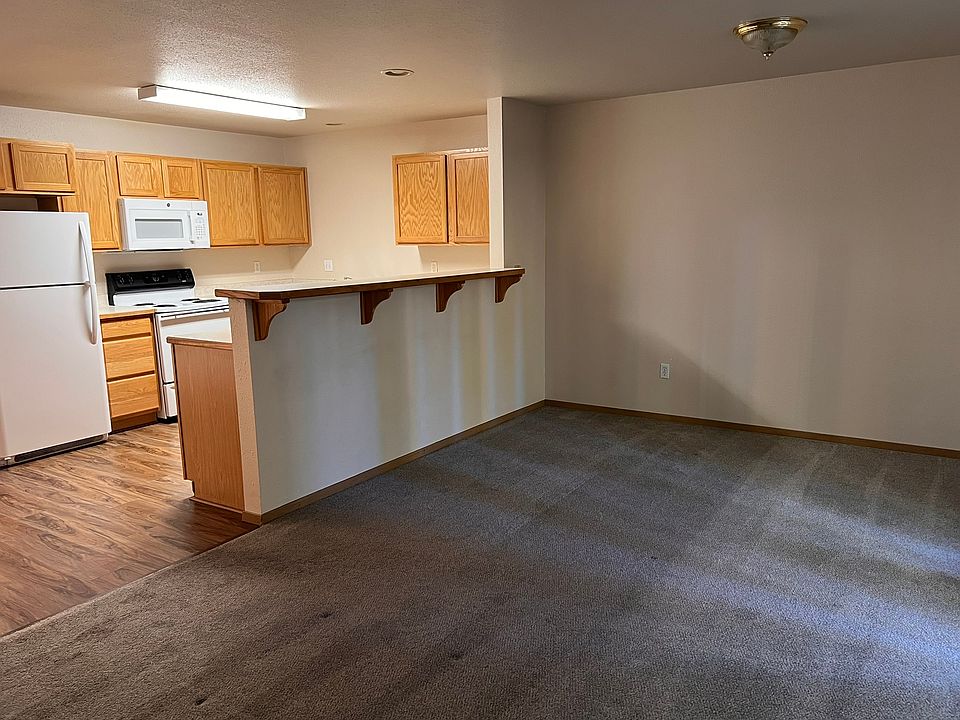 view of kitchen from living room, not pictured is the sliding door to patio on the right