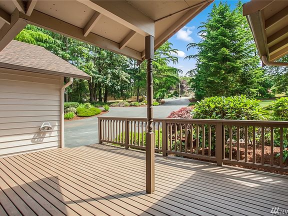 The view from the covered porch looking back to the front of the lot. Imagine enjoying the sunrise with a cup of coffee on this deck looking over the peaceful Northwest setting.
