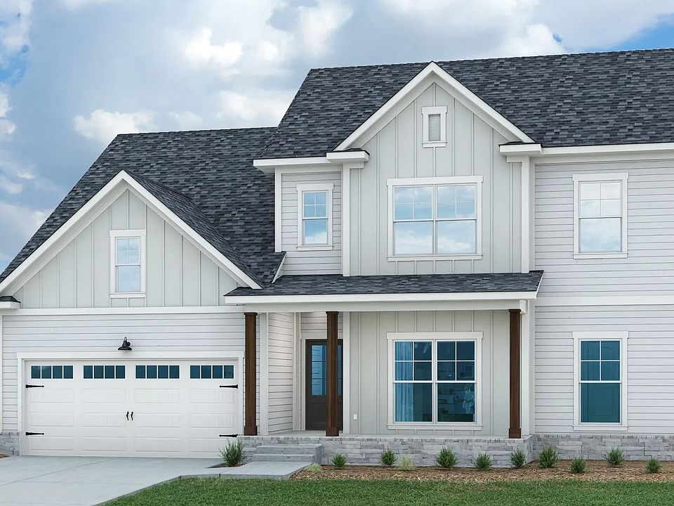 Elegant modern home with striking gabled roof and expansive windows in Natchez, Richvale Estates.