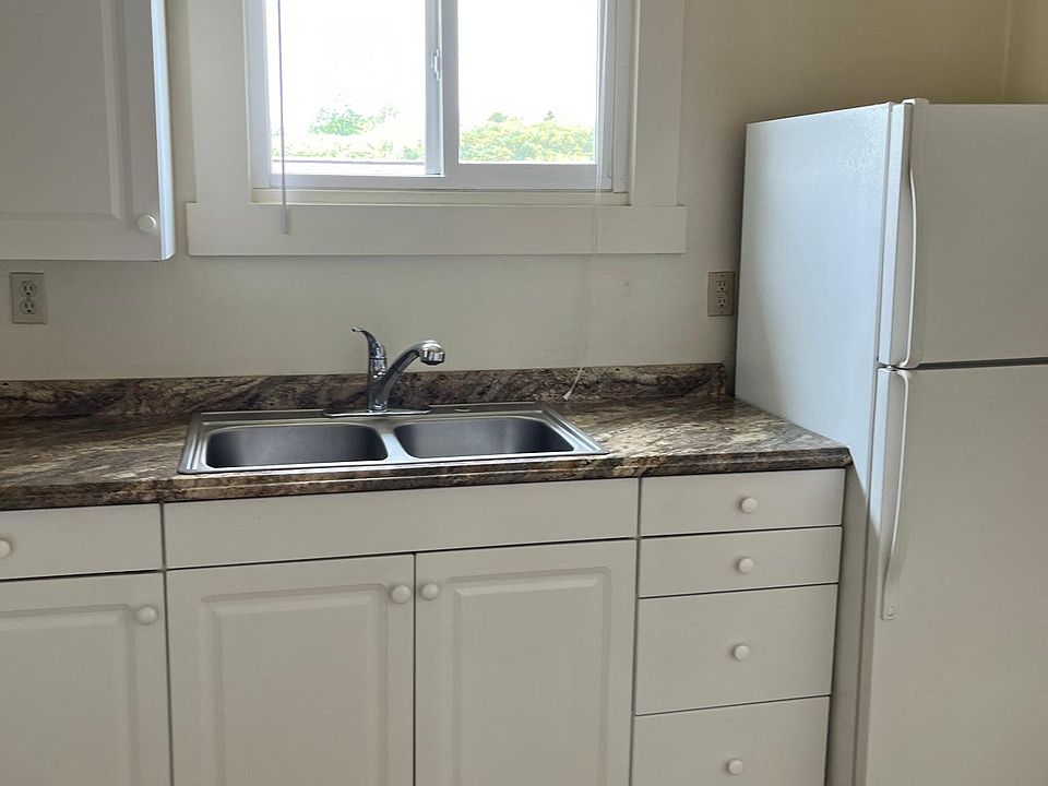 Kitchen equipped with stove and refrigerator