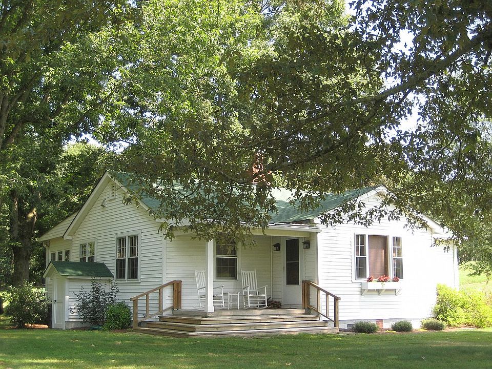 Absolutely charming classic farmhouse bungalow, lovingly restored retaining its original charm while offering modern conveniences.