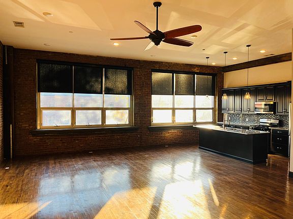 Living area & kitchen. Windows overlook Union.