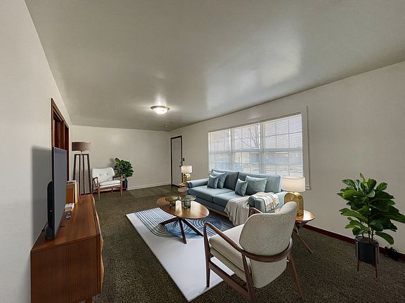 Living Room - Furniture is styled to show how modern furniture would look, but any style of furniture will make it homey.