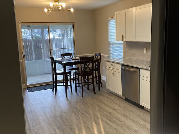 Kitchen view leading into sunroom