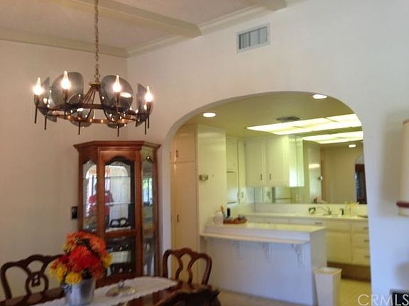 Through dining room to kitchen. Inset lighting in hall area.