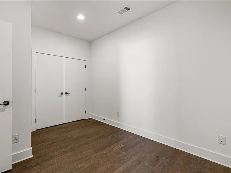 Flex Space / Den (Note: Actual unit has light wooden floors and upgraded fixtures / appliances)