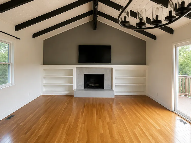 Large, spacious living/family room area. French doors that lead to the upper deck.