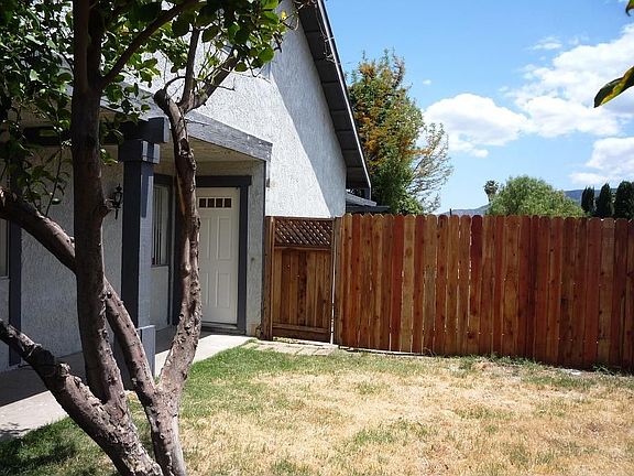 Privacy fence to the backyard and sheltering front door walkway