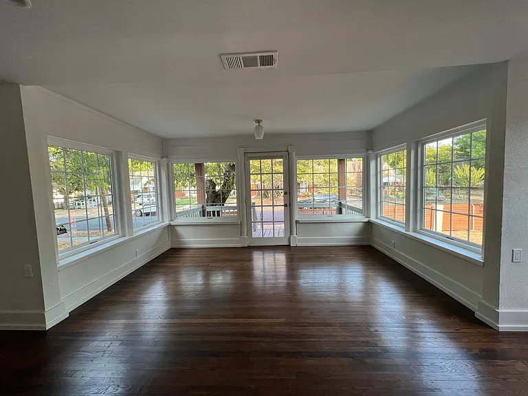 Beautiful entry with newly installed, double-pane, energy efficient wrap around windows.
