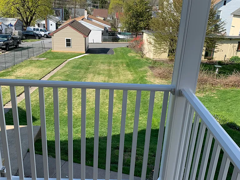 Rear yard - looking at single car garage and off street parking