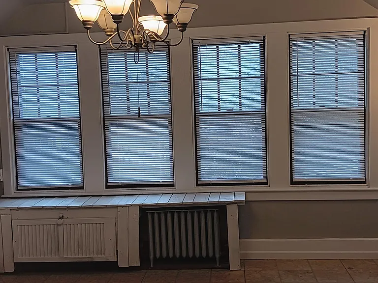 Kitchen windows providing lots of natural light and view to the backyard.