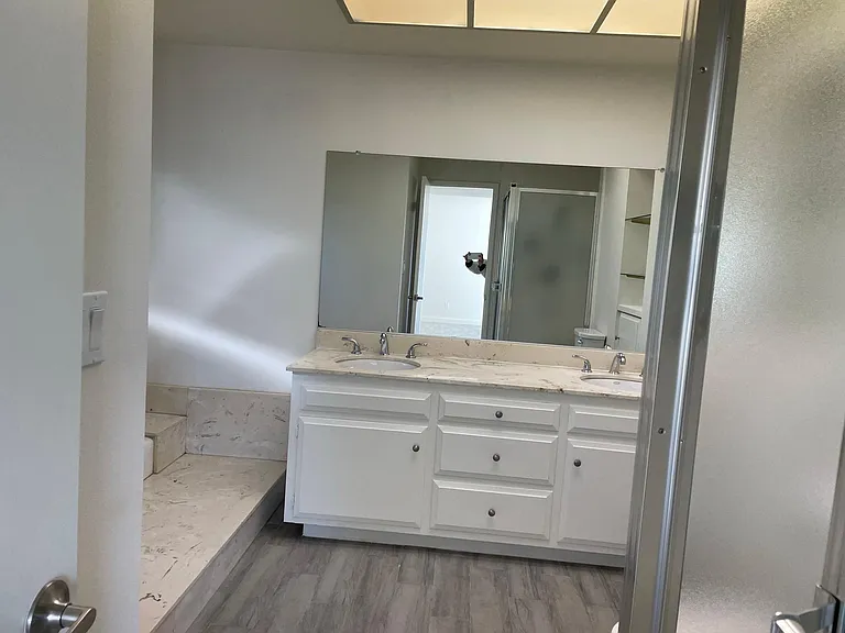 Master Bath w/ Dual Sinks, Shower to right and Tub to left