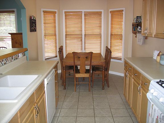 Eat-in kitchen with bay window overlooking the pool