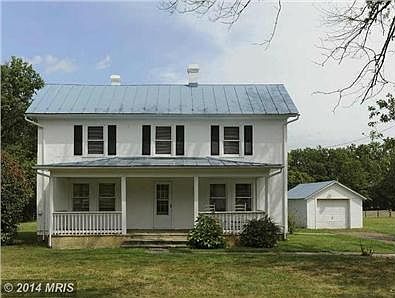 Detached 1-car garage/shop to right of house.