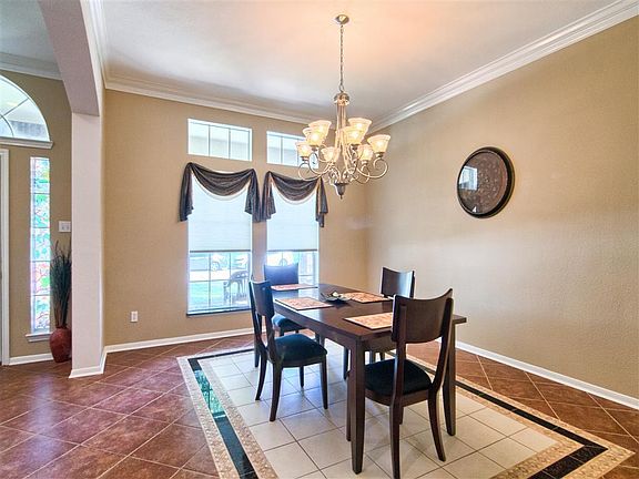 Have the family over in this tiled formal dining room!