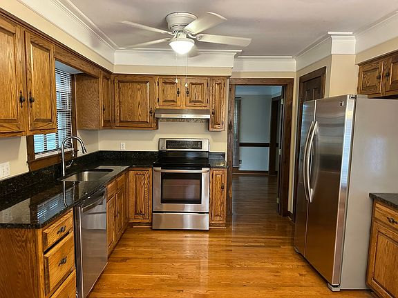 Kitchen with Stainless steel appliances and granite countertops.
