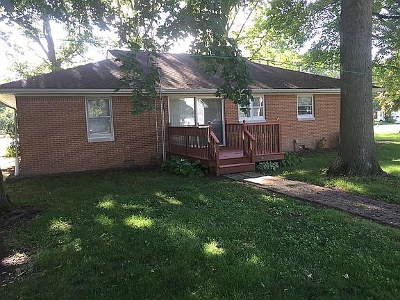 Back of house with deck