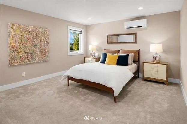 The lower level offers two bedrooms, each with its own custom-organized closet.