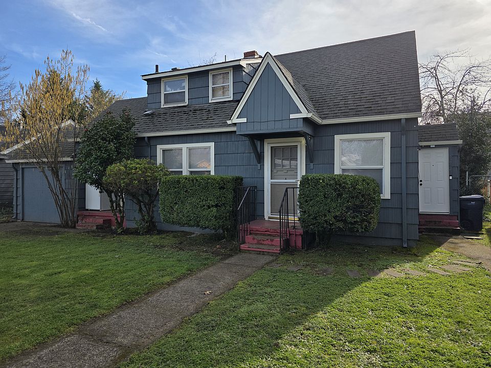 Front of home (faces W. 11th). Door to far right is to upper unit. This unit has 2 front doors and 1 rear door.