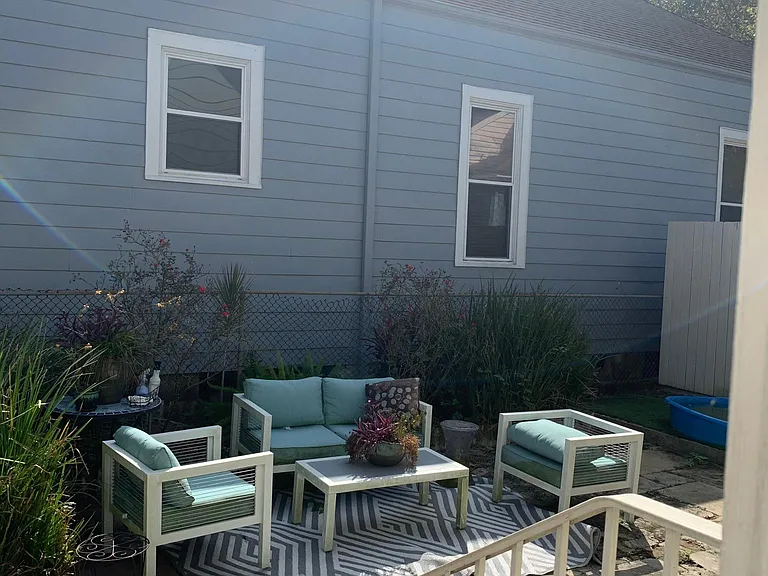 Spacious backyard provides plenty of space for outdoor furniture and a barbecue pit