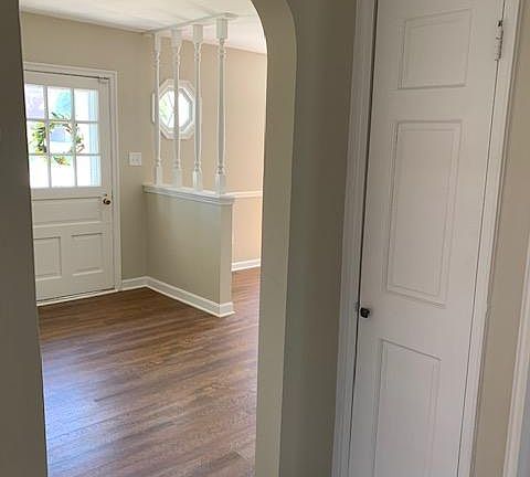 Middle hallway into entry with coat closet