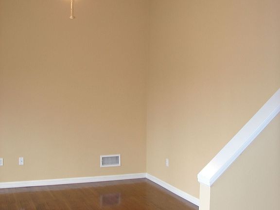 LR with vaulted ceiling and pendant fan