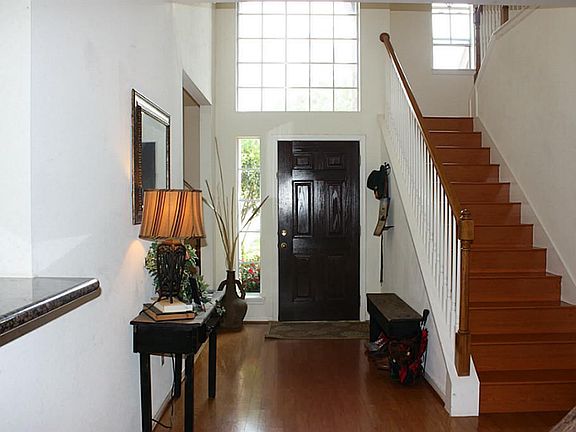 Welcome home into this fabulous entry with the formal dining on the right